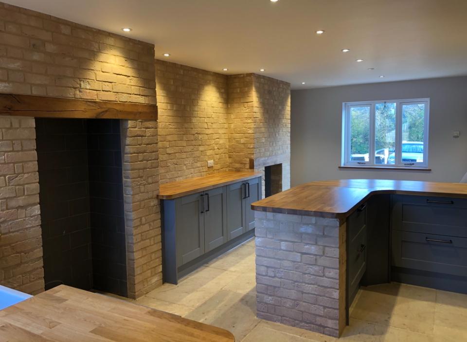 Completed brick and plaster work in a modern kitchen